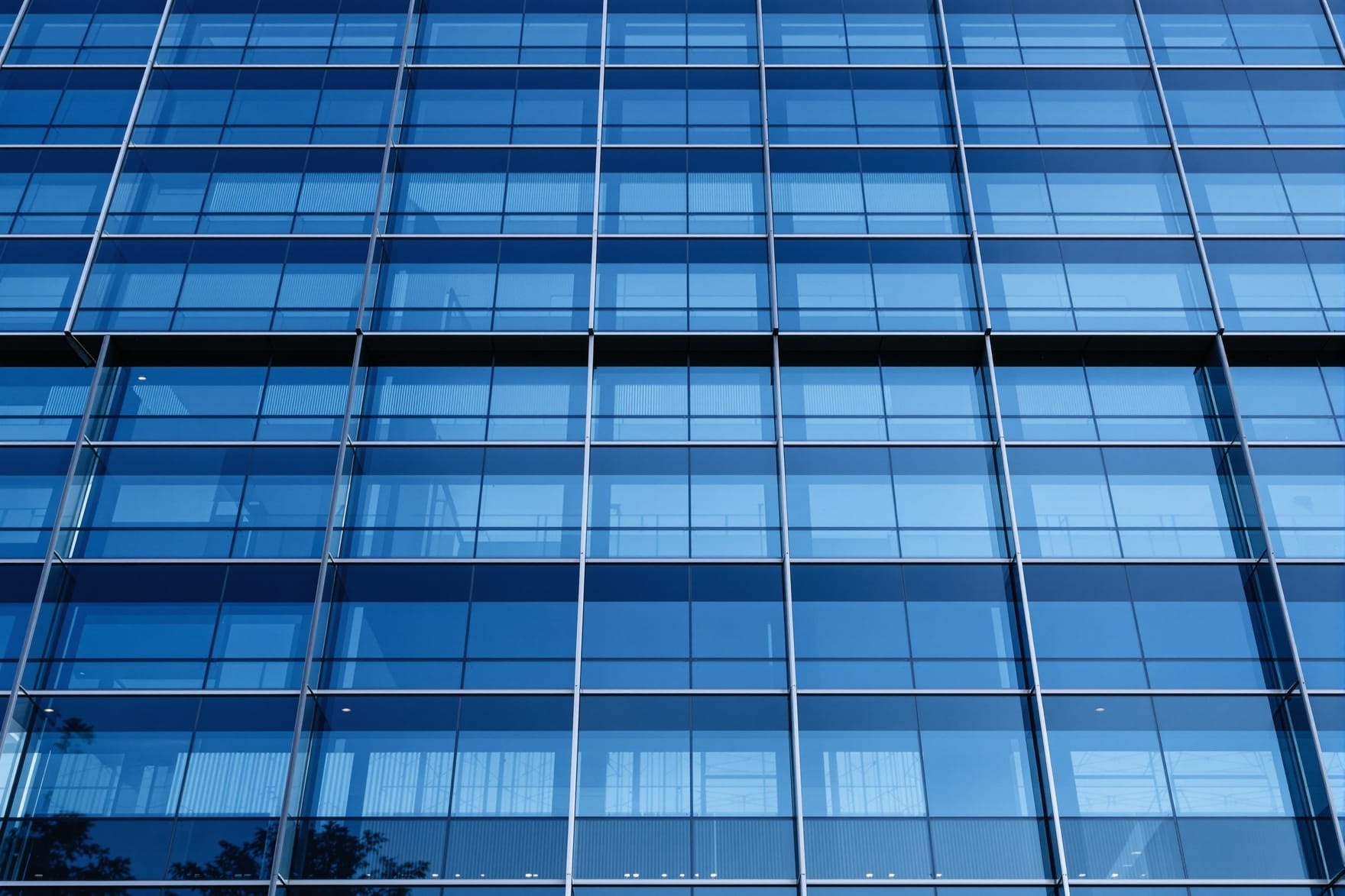 Glass office facade, representing the corporate headquarters activity the Chamber tracked in its region